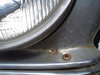 driver's headlight bezel dent.jpg