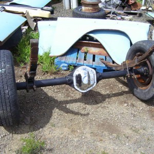 The Dana 44 after John Deere Blitz Black paint and rebuilding The old leafs are there to keep the yoke out of the dirt.