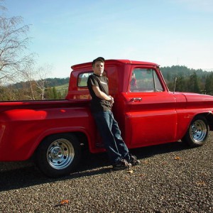 My son in High School with the truck as we got her from the former owner.  You can see  from this angle how bad the door and front fender line up.  We