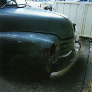 For years, parts were being stolen off of this truck:  headlight bucket gone...when I got it home, found this fender was mostly unbolted, radiator gon