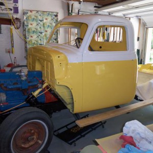 Paint on the cab.  Now the windshield and rear glass are installed.  Gas tank also, and fuel/vacuum lines.  Doors and latches.  Wiring coming next.